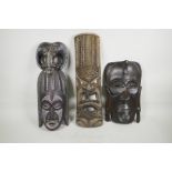 Three carved wood ethnic tribal masks, largest 21" long