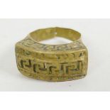 A Roman legionary brass ring with pierced Greek key decoration