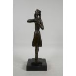 After Dsaky, a stylised bronze figure of a ballet dancer, mounted on a marble plinth, 13" high