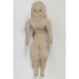 An ancient Indus Valley terracotta fertility figure of a lady, 5" long, A/F