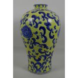 A Chinese porcelain baluster vase shaped lamp with yellow glaze and blue leaf decoration, 14" high
