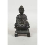 A Chinese bronze figure of Buddha seated in meditation, 4" high