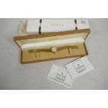 A Gucci ladies' gold plated 9200 L wristwatch with date aperture and original bracelet strap, marked