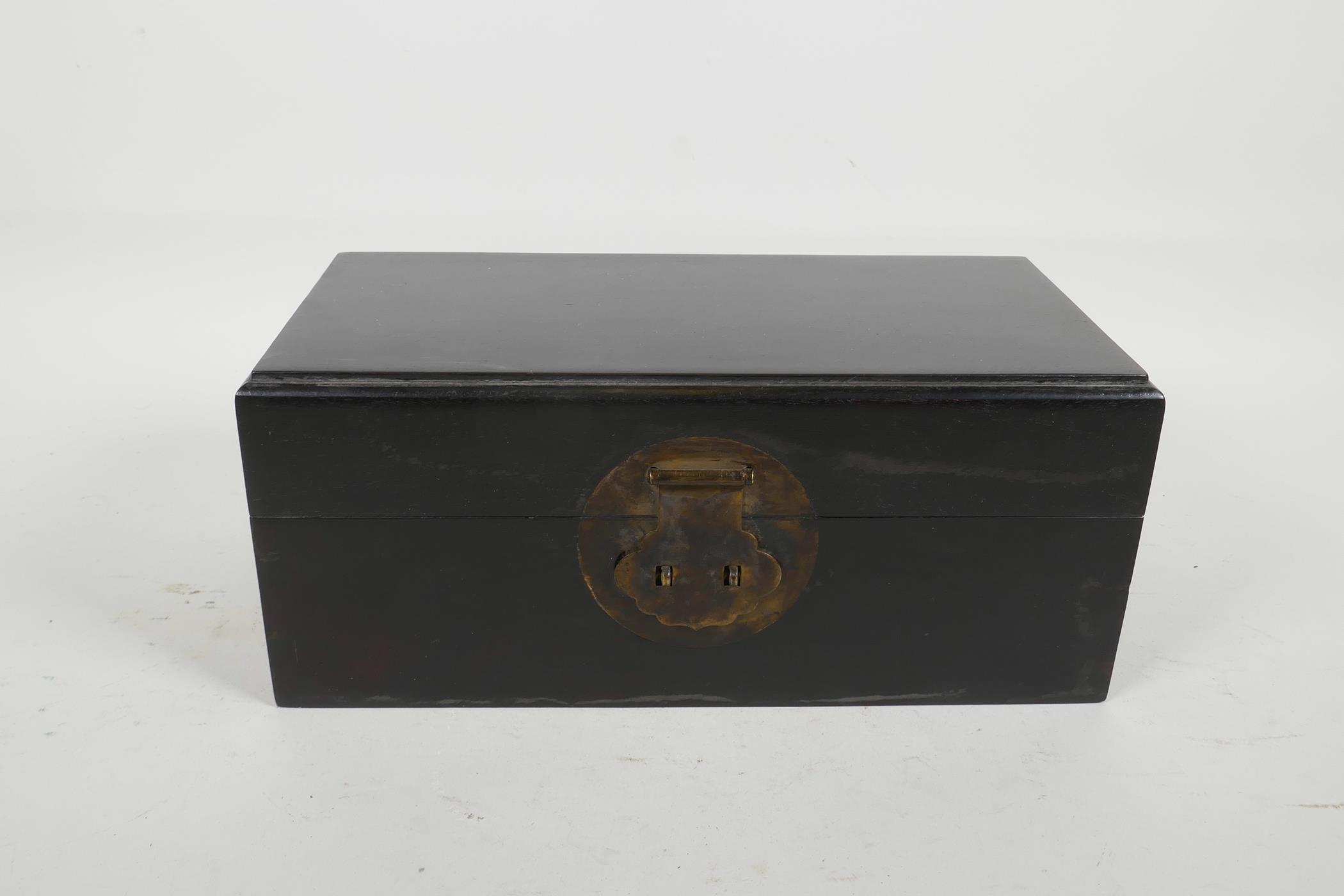 An oriental ebonised hardwood box, with brass fittings, 10" x 5" x 4½"