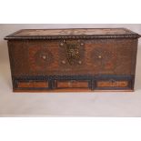 A late C19th teak Zanzibar chest with ebonised mouldings and brass feet and stud decoration, 43" x