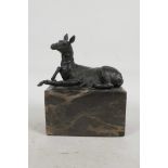 A bronze figure of a foal, mounted on a marble plinth, 6" high