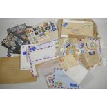 A folder of stamps and envelopes etc