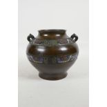 A Chinese bronze and champleve enamel vase, decorated with geometric bands, character marks to base,