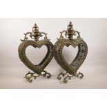 A pair of coppered metal heart shaped lanterns with pierced decoration, 18" high