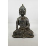 A Chinese bronze figure of Buddha seated in meditation, 14" high