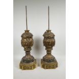 A pair of ornate urn shaped gilt spelter lamp bases, 17" high to top of urn