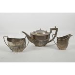 A silver Queen Anne style teapot, jug and sugar bowl by Alexander Clark & Co Ltd of Birmingham,