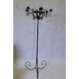 A wrought metal six branch candle stand, with twisted column and scrolled supports, 22" x 56"