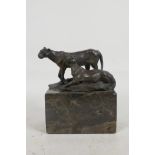 A stylised figure of two lions, mounted on a marble plinth, 6" high