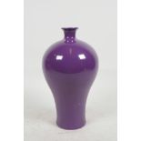 A Chinese porcelain baluster vase with all over purple glaze, seal mark to base, 9" high