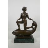An Art Deco style bronze figure of a siren riding a fish, stamped Fremiet, mounted on a marbled base
