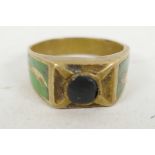 A Roman yellow metal ring with green enamelled decoration to the shoulders