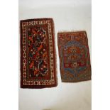 Two Islamic prayer rugs decorated with geometric patterns on a red field, one A/F worn, largest
