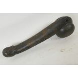 A carved stone phallus, 10½" long