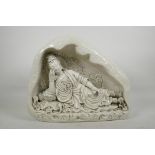 A large Chinese blanc de chine porcelain figure of Quan Yin reclining on a lotus flower, impressed