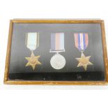 A suite of three WWII medals including Air Crew Europe Star, framed