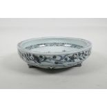 A Chinese blue and white porcelain shallow bowl decorated with branches in bloom, 8" diameter