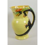 An Art Deco Burleigh ware pottery jug, the handle moulded as a dragon, painted in bright enamels, 8"