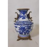 A large Chinese blue and white porcelain vase with ormolu style mounts decorated with figures in