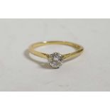 An 18ct gold set solitaire diamond ring, size 'S', gross 2 grams