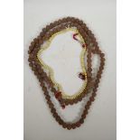 A string of Tibetan prayer beads and a string of mala beads