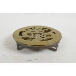 A vintage Chinese brass top lazy Susan with pierced and engraved dragon design, 5½" diameter