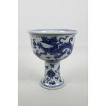 A Chinese blue and white porcelain stem bowl with dragon, phoenix and lotus flower decoration, 4