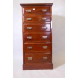 An Edwardian mahogany chest of six drawers with moulded fronts, raised on a plinth base, 24" x 19" x