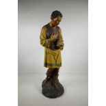 A wood and plaster figure of a pious gentleman with offertory box, 28" high