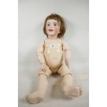 A large SFBJ doll with bisque head having closing eyes and open mouth with two teeth, with