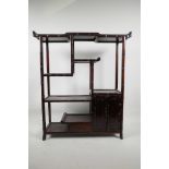A Chinese hardwood display rack with carved bamboo decoration, 22" high, 19½" wide