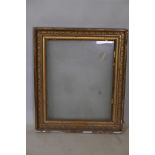 A C19th giltwood and composition picture frame with grape and vine moulded decoration, rebate 18"