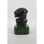 A bronze head and shoulders bust, mounted on a marbled plinth, 6" high