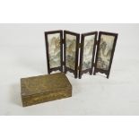 A Chinese brass table cigarette box embossed with dragons and mythical beasts, 6" x 3½" x 2" ,