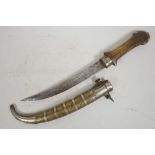 A Moorish dagger with wood handle and brass and white metal scabbard with engraved decoration, 15"