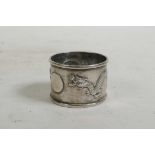 A Chinese silver napkin ring with repoussé dragon and flaming pearl decoration, Chinese silver marks