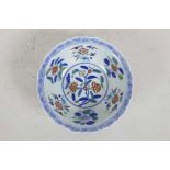 A Chinese Doucai porcelain bowl with lobed rim painted with flowers, six character mark to base,