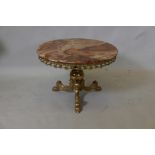 A brass occasional table with baluster column and tripod supports, and inset onyx top, 24" x 17"