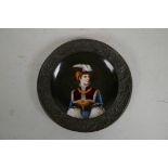 A Continental porcelain chiselled plate decorated with a figure in distinguished costume, 6"