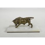 A bronze sculpture of a bull, mounted on an onyx base, 4½" long
