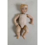 An antique mignonette doll having ceramic head with closing eyes and composition body and limbs,