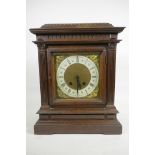 An Edwardian carved mahogany mantel clock by the Black Forest clockmakers Lenzkirch of Germany,