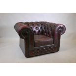 A button back leather Chesterfield style armchair