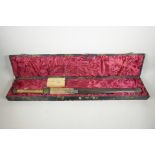 A Chinese ceremonial sword in hardwood scabbard, decorated with cast bronze embellishments, the