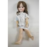 A large Heubach doll with bisque head, having sleeping eyes, open mouth and four teeth, no. 250.7,